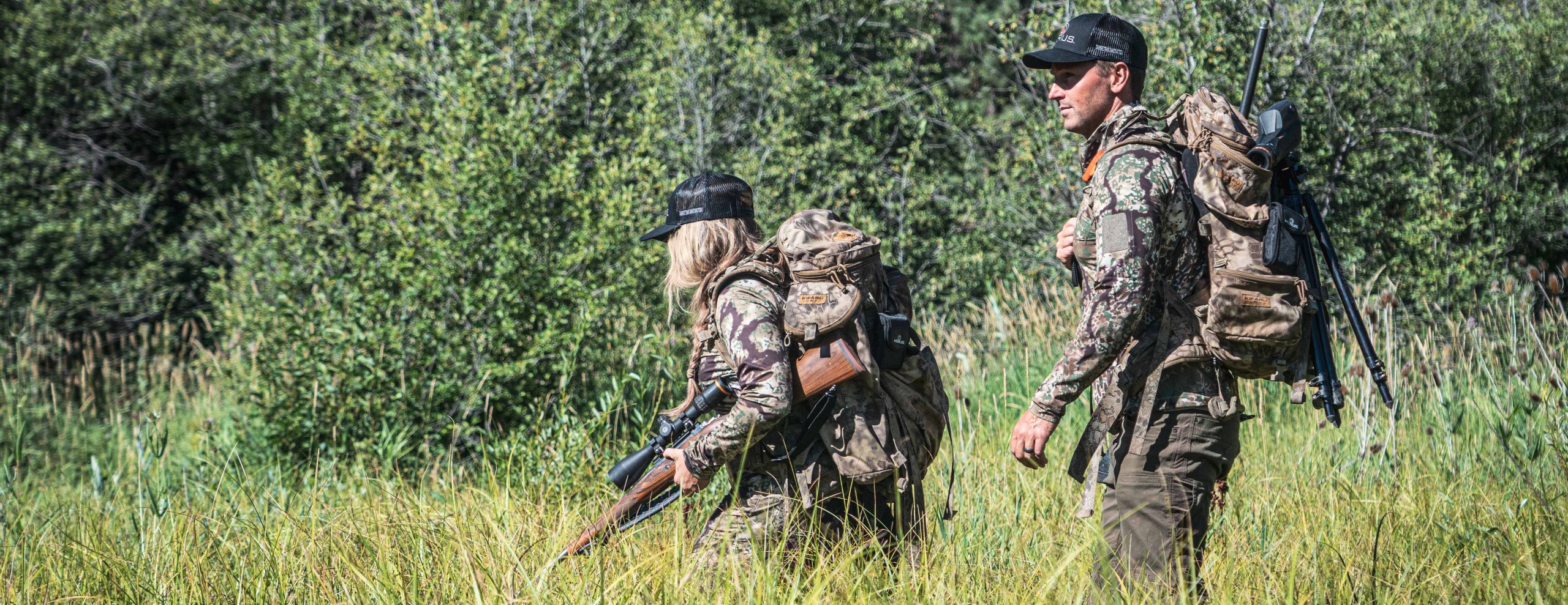 Shooter using a Horus optic in field terrain