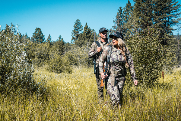 Hunters walking through the woods