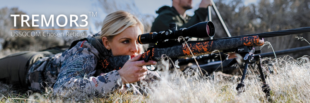 Woman shooting a rifle with TREMOR3 Reticle
